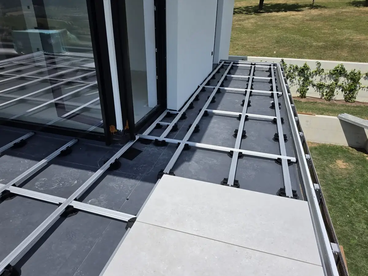First full paver dropped in at the edge of a Slovenia mansion rooftop grid