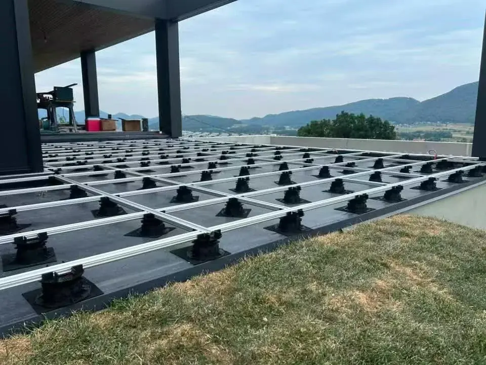 Aluminium joist grid laid on adjustable pedestals at a Slovenia mansion rooftop